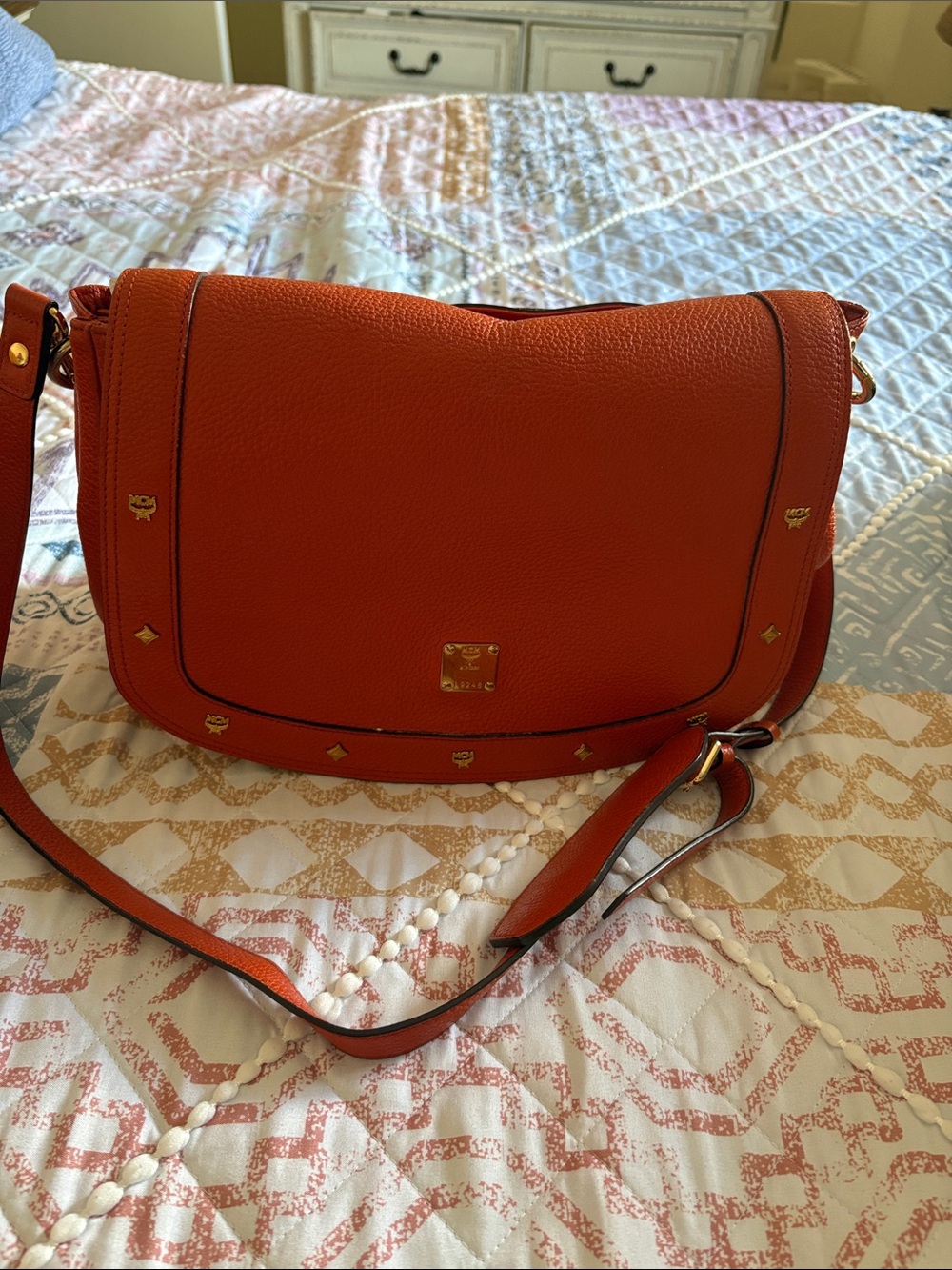 MCM Orange Pebbled Leather Crossbody with Gold Stud Accents
